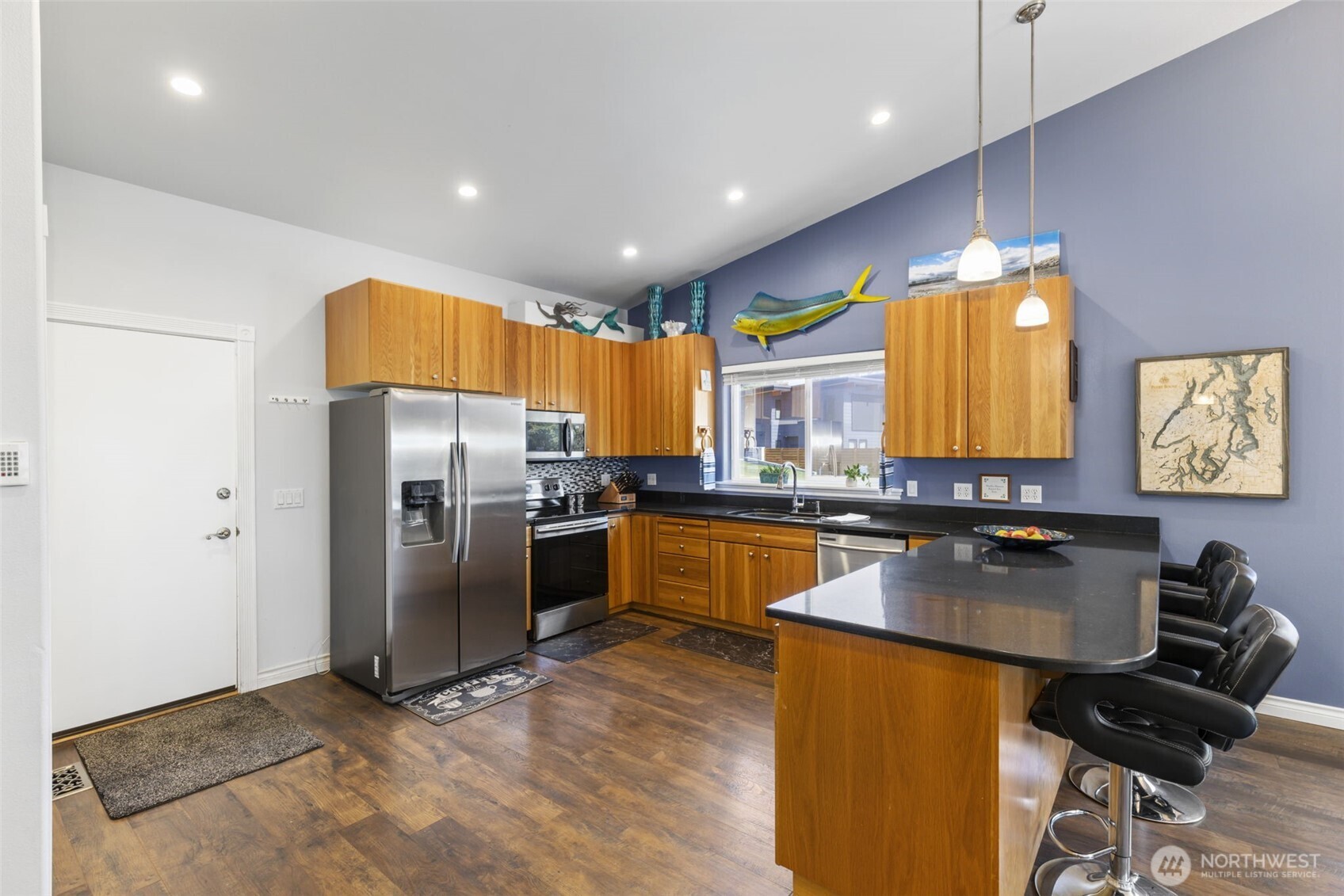 38292 Northeast Doe Road Hansville, WA 98340 - Photo 22 of 40 a kitchen with granite countertop kitchen island stainless steel appliances a refrigerator a sink a stove a counter top space and cabinets