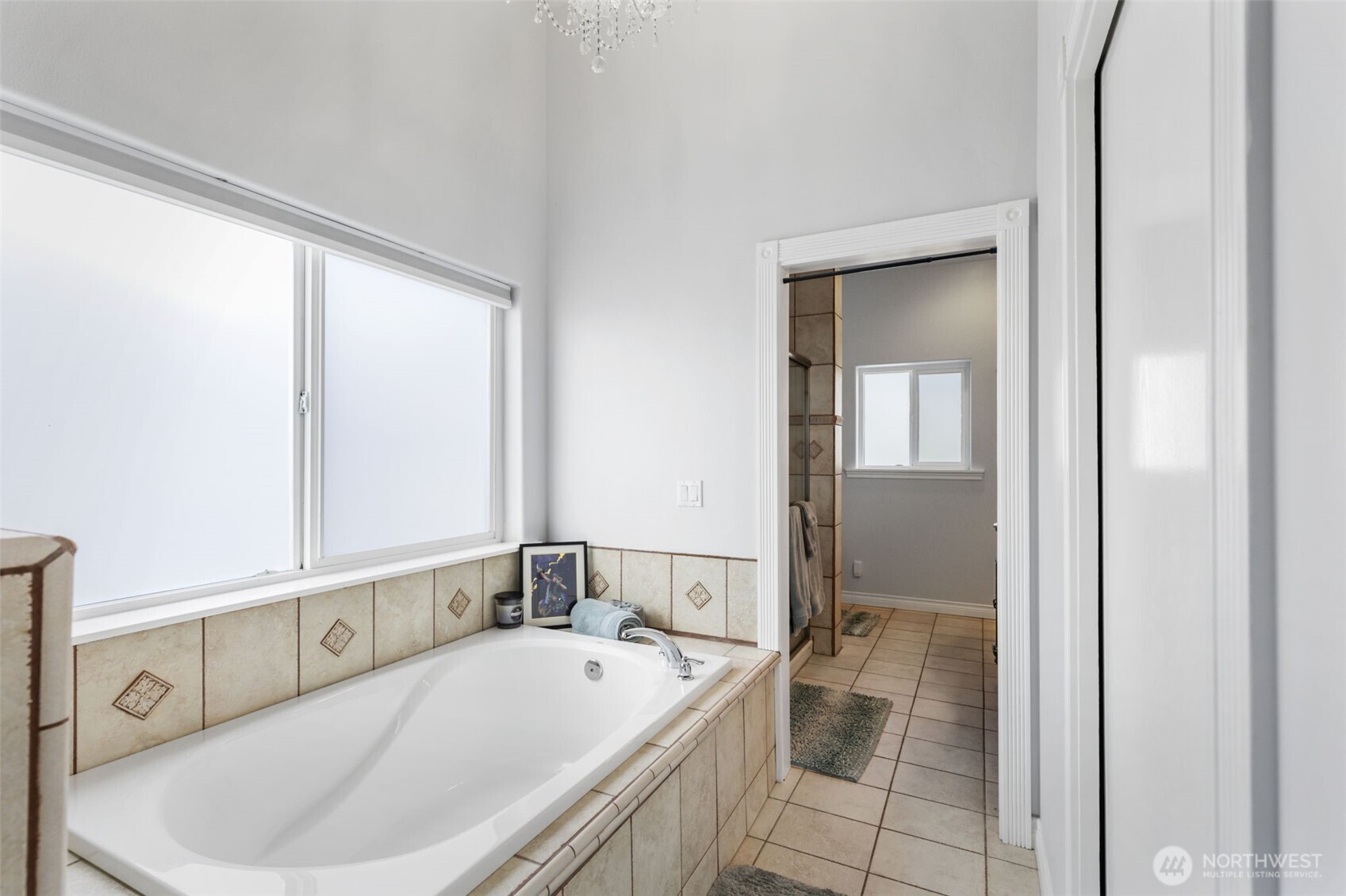 38292 Northeast Doe Road Hansville, WA 98340 - Photo 28 of 40 a bathroom with a tub a sink and a mirror