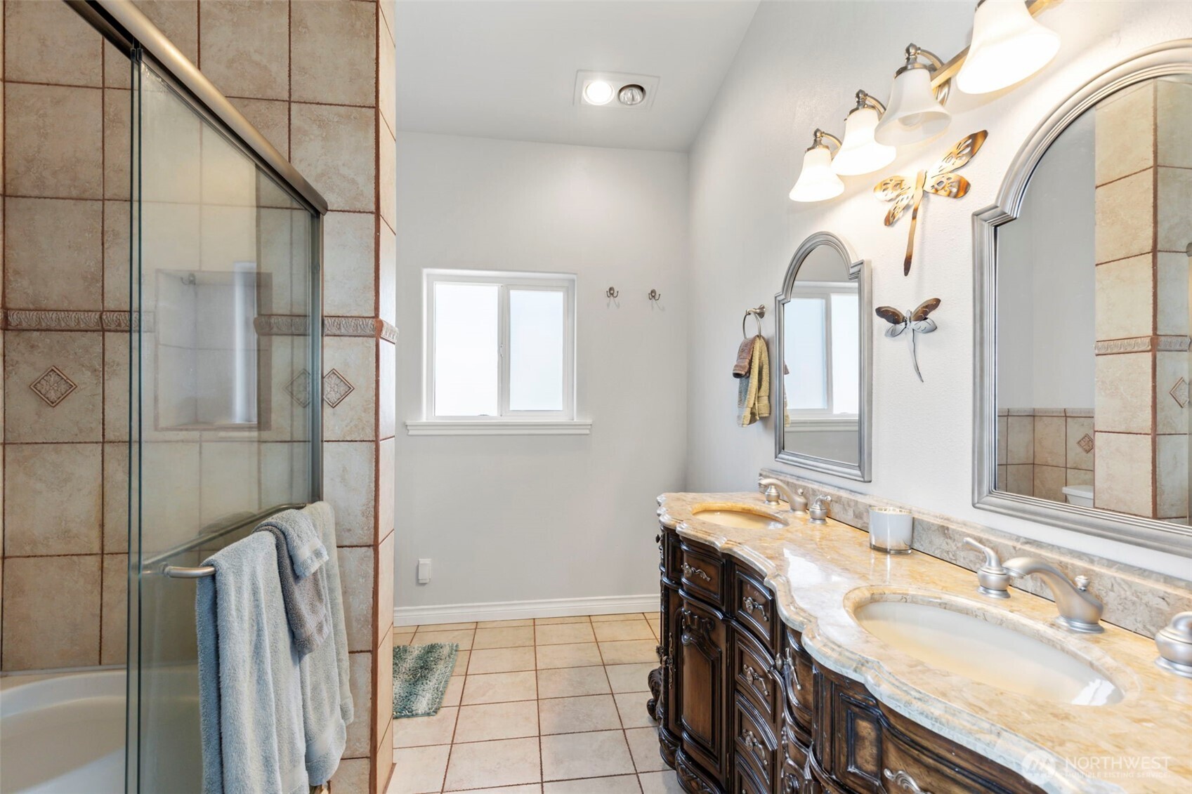 38292 Northeast Doe Road Hansville, WA 98340 - Photo 29 of 40 a bathroom with a granite countertop sink a large mirror and a shower
