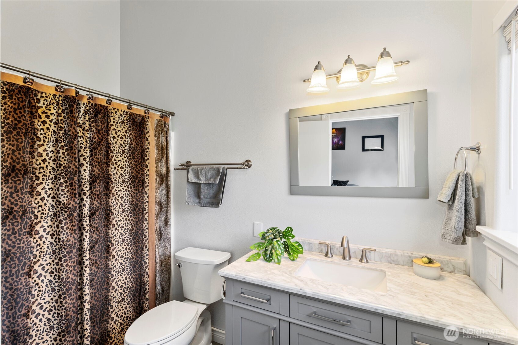 38292 Northeast Doe Road Hansville, WA 98340 - Photo 32 of 40 a bathroom with a granite countertop sink and a toilet