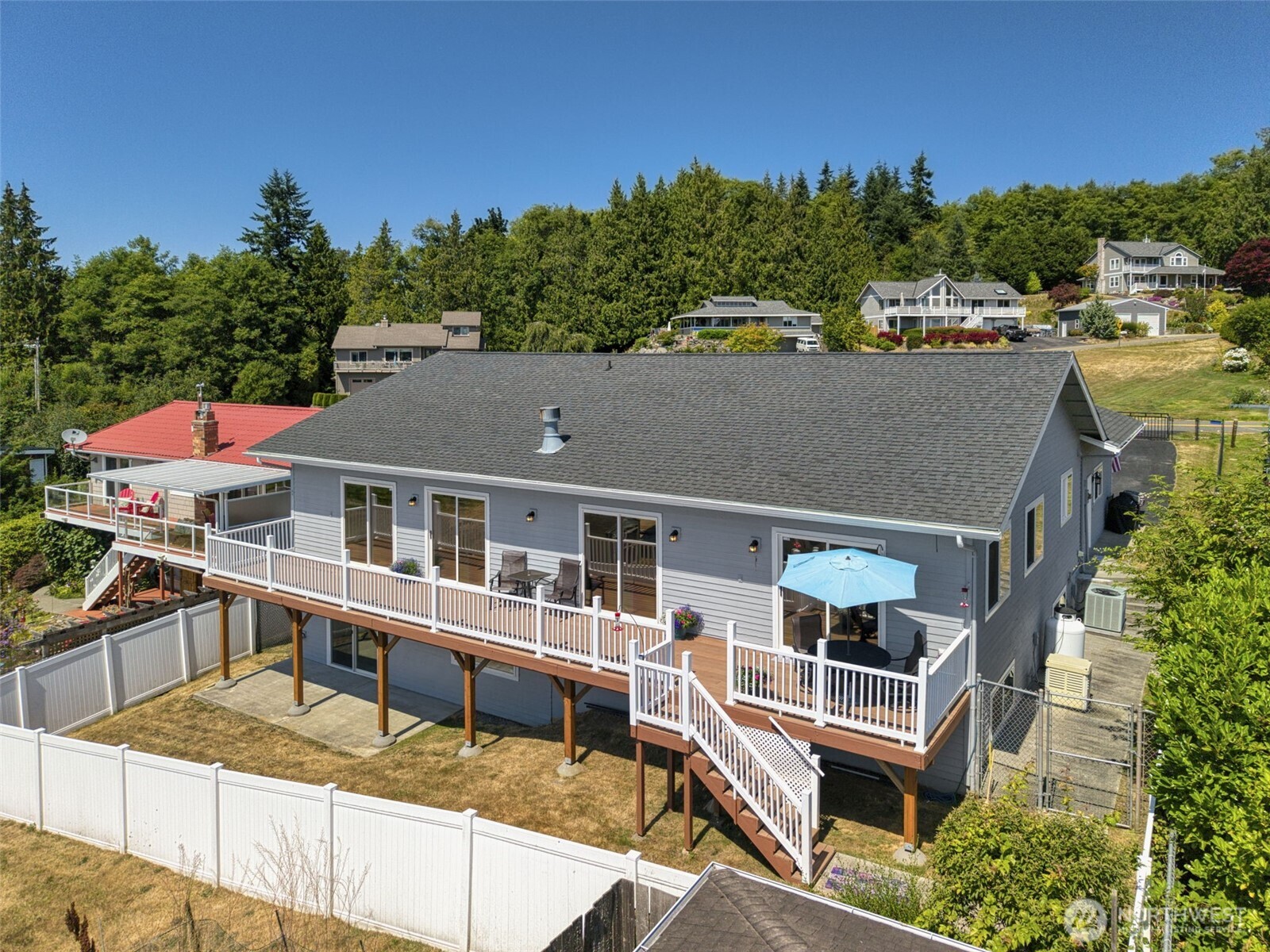38292 Northeast Doe Road Hansville, WA 98340 - Photo 5 of 40 an aerial view of a house with swimming pool and sitting area