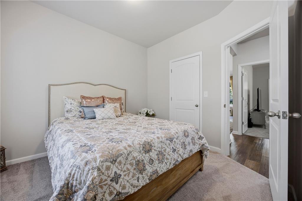 70 Gold Mine Road Grantville, GA 30220 - Photo 16 of 23 a bedroom with a bed and a mirror