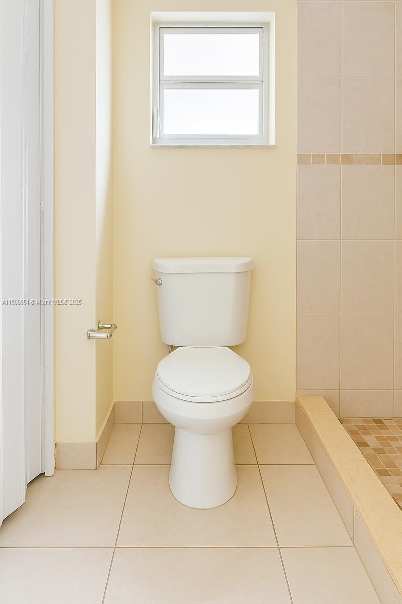 1741 Southwest 17th Court Miami, FL 33145 - Photo 12 of 13 a bathroom with a toilet and a shower
