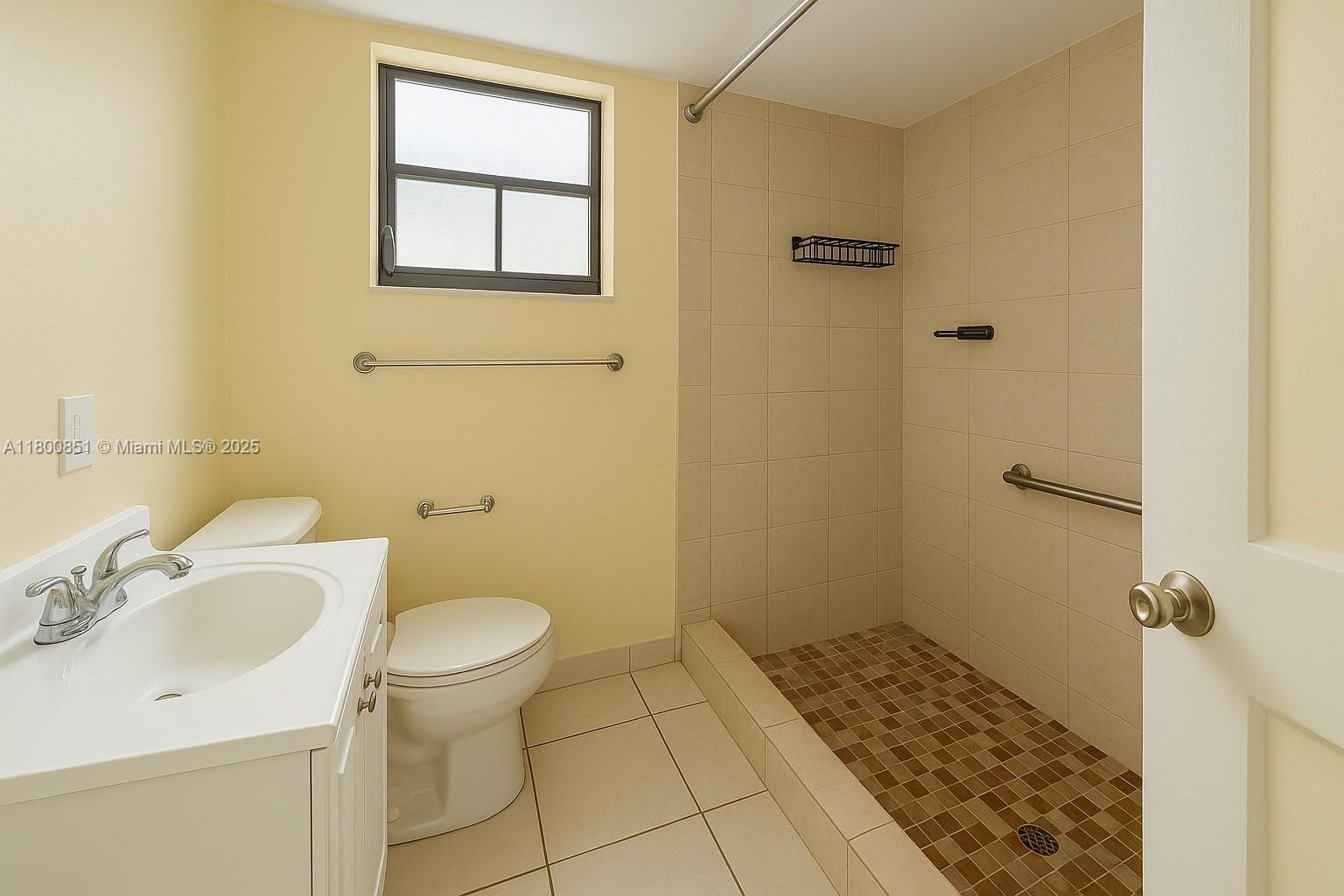 1741 Southwest 17th Court Miami, FL 33145 - Photo 5 of 13 a bathroom with a sink toilet and shower