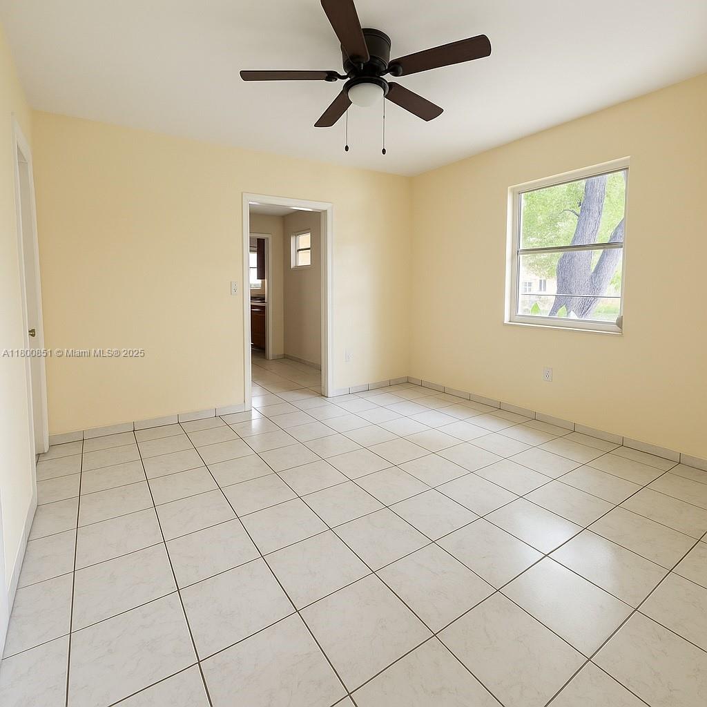 1741 Southwest 17th Court Miami, FL 33145 - Photo 7 of 13 a view of an empty room and window