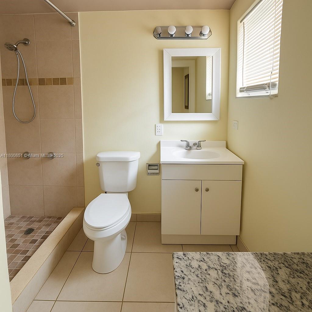 1741 Southwest 17th Court Miami, FL 33145 - Photo 8 of 13 a bathroom with a sink toilet and shower