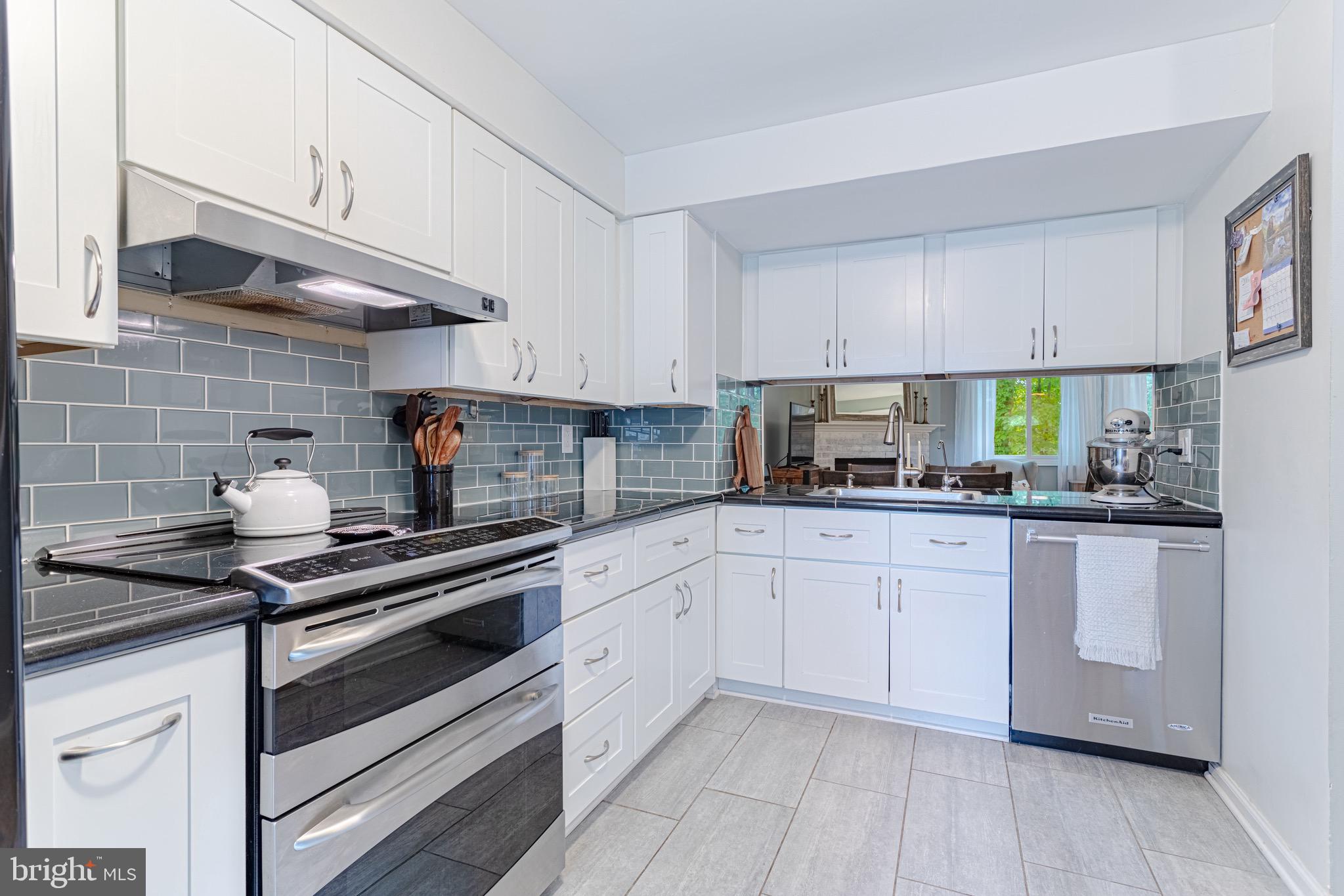 8325 Windfall Road Springfield, VA 22153 - Photo 8 of 34 Modern kitchen with white cabinets
