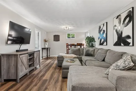 a view of a livingroom with furniture and wooden floor