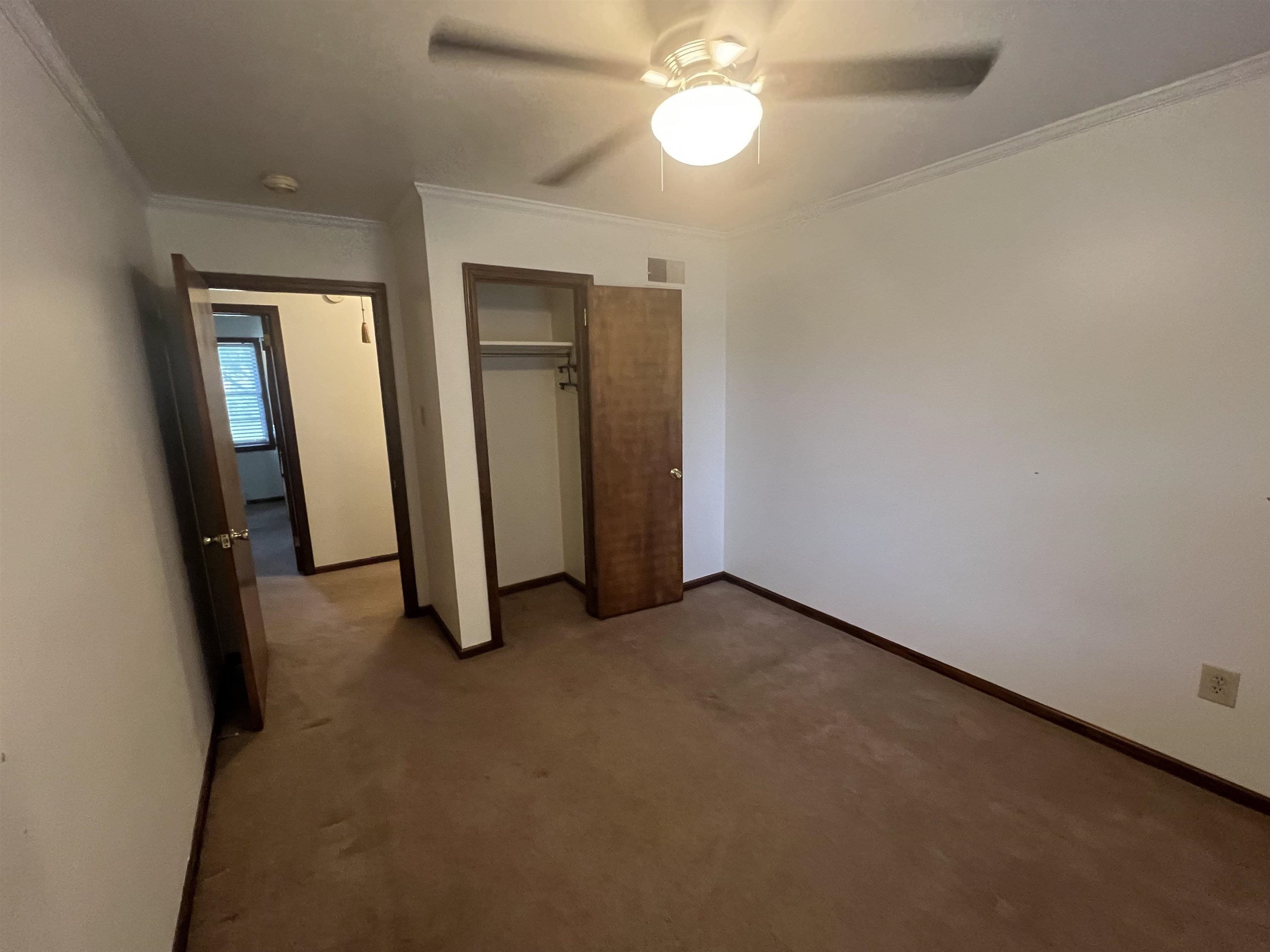 7202 Renda Street Millington, TN 38053 - Photo 14 of 18 an empty room with windows and closet