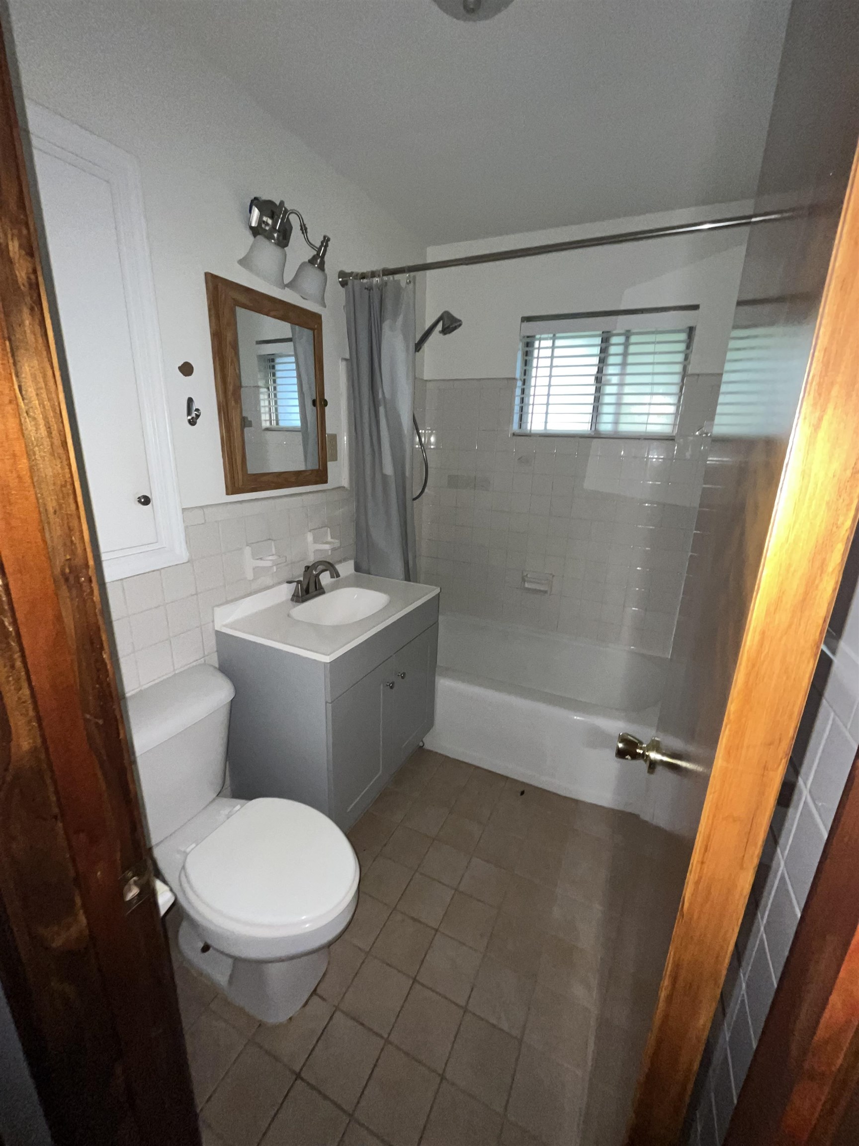 7202 Renda Street Millington, TN 38053 - Photo 9 of 18 a white toilet sitting next to a bathroom sink