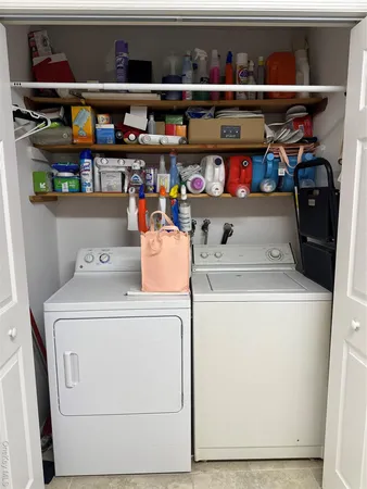 a utility room with washer and dryer