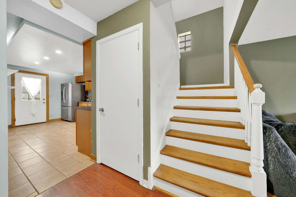7234 South Ridgeway Avenue Chicago, IL 60629 - Photo 8 of 27 a view of a hallway with entryway and wooden floor
