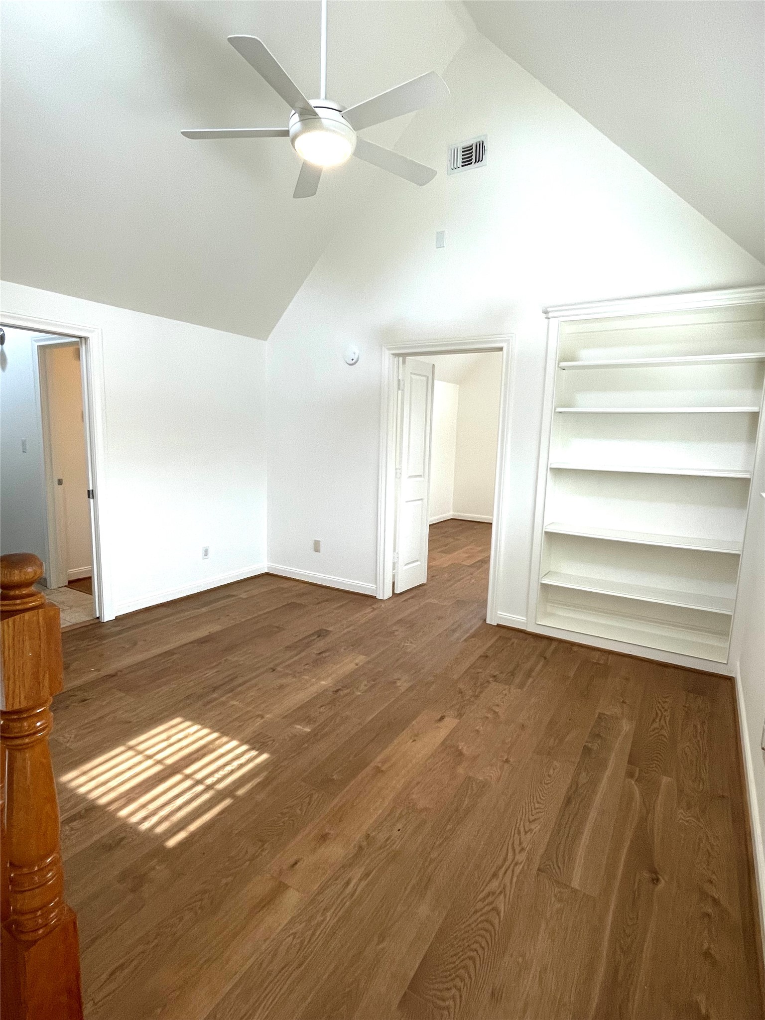 4334 Jefferson Street Houston, TX 77023 - Photo 11 of 31 a view of empty room with wooden floor and fan
