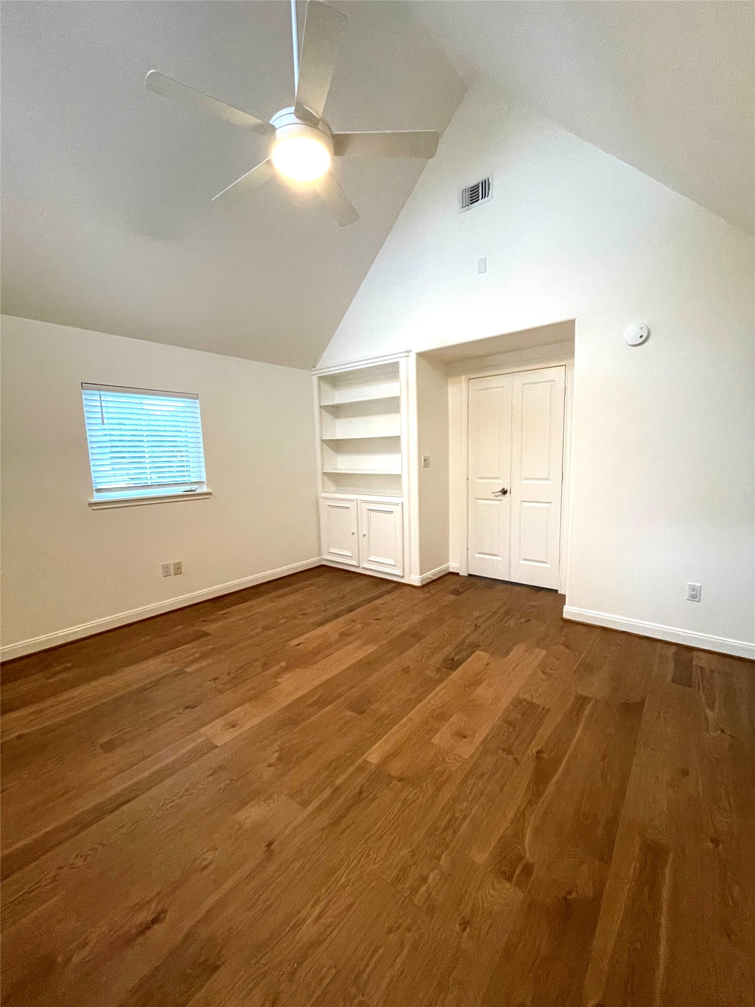 4334 Jefferson Street Houston, TX 77023 - Photo 13 of 31 a view of empty room with wooden floor and fan