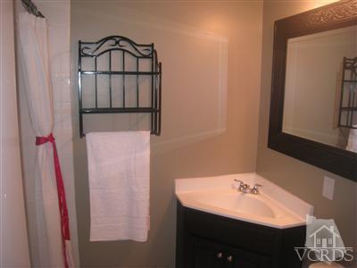 2958 Racine Street Simi Valley, CA 93065 - Photo 7 of 10 a bathroom with a sink vanity and a mirror
