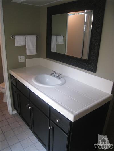 2958 Racine Street Simi Valley, CA 93065 - Photo 8 of 10 a bathroom with a sink vanity and mirror
