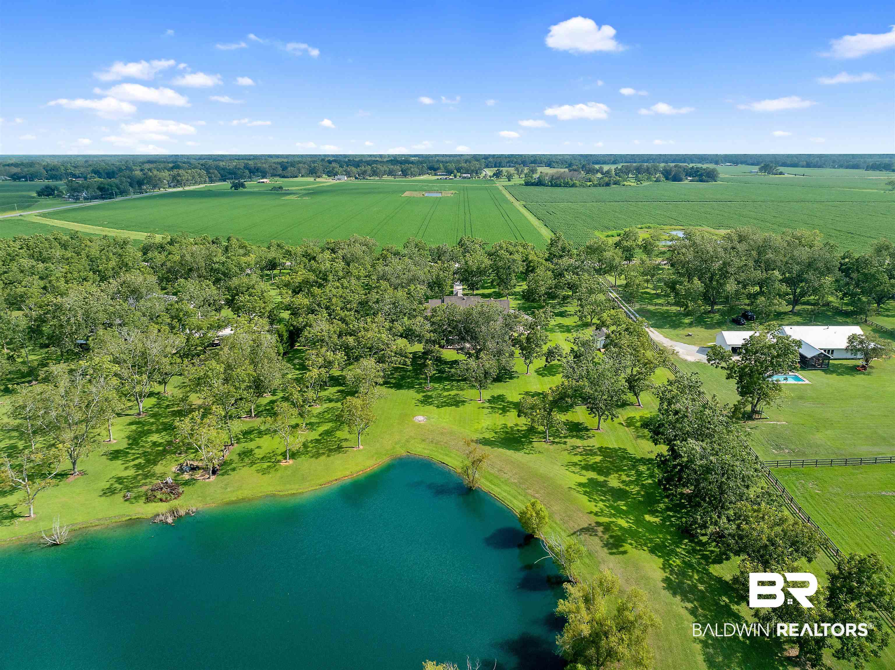 8753 Bishop Road Fairhope, AL 36532 - Photo 58 of 59 Aerial property overview featuring a large, blue-green pond