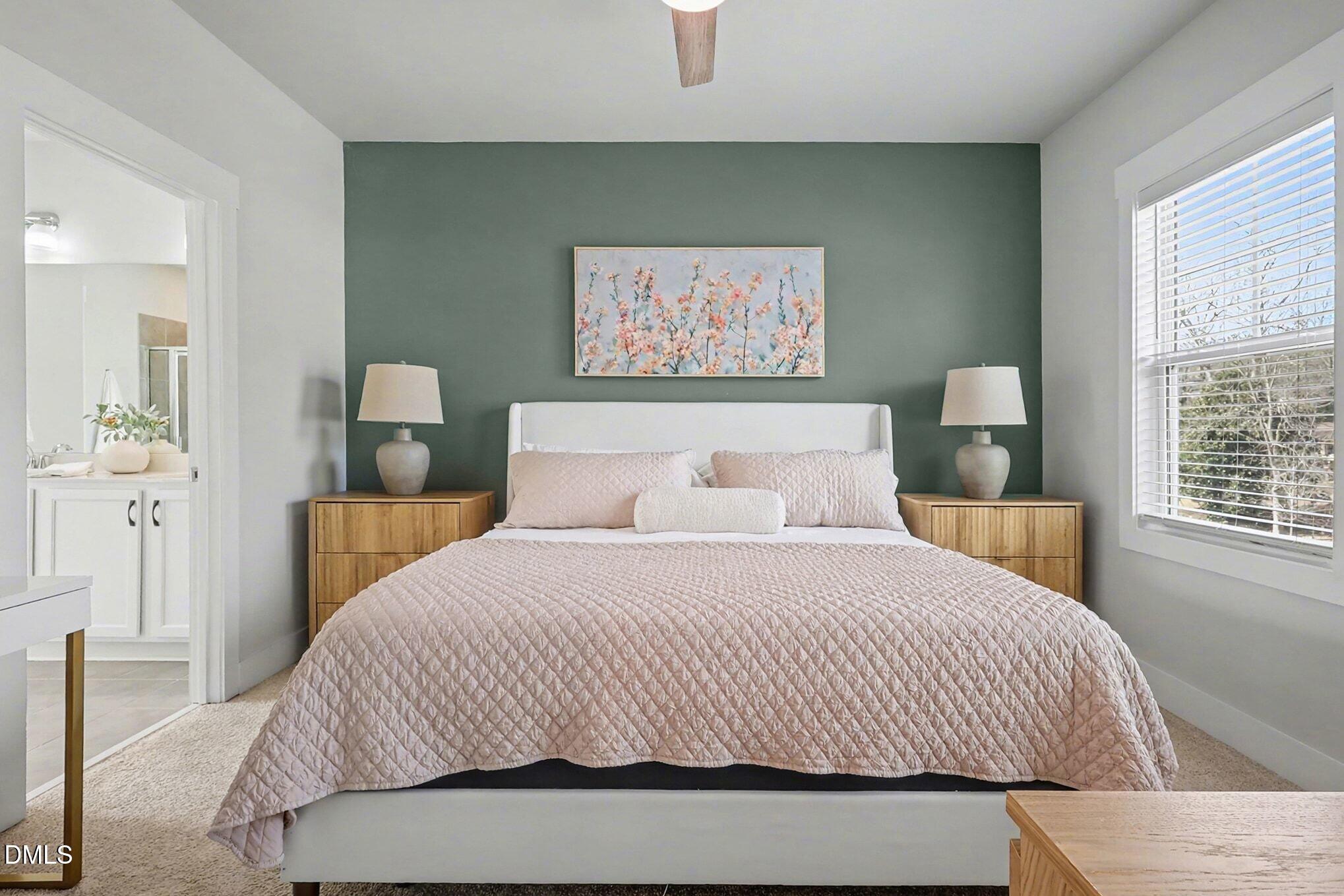 235 Sneed Lane Fuquay-Varina, NC 27526 - Photo 22 of 63 a bedroom with a bed and a painting on the wall