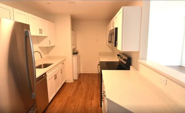 a view of a living room with a flat screen tv