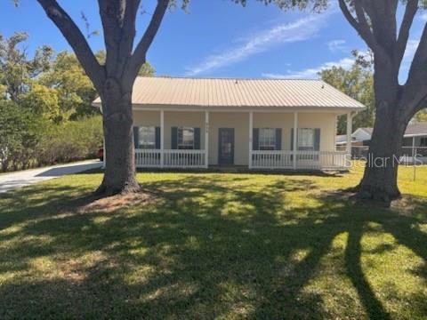 a view of a house with a yard