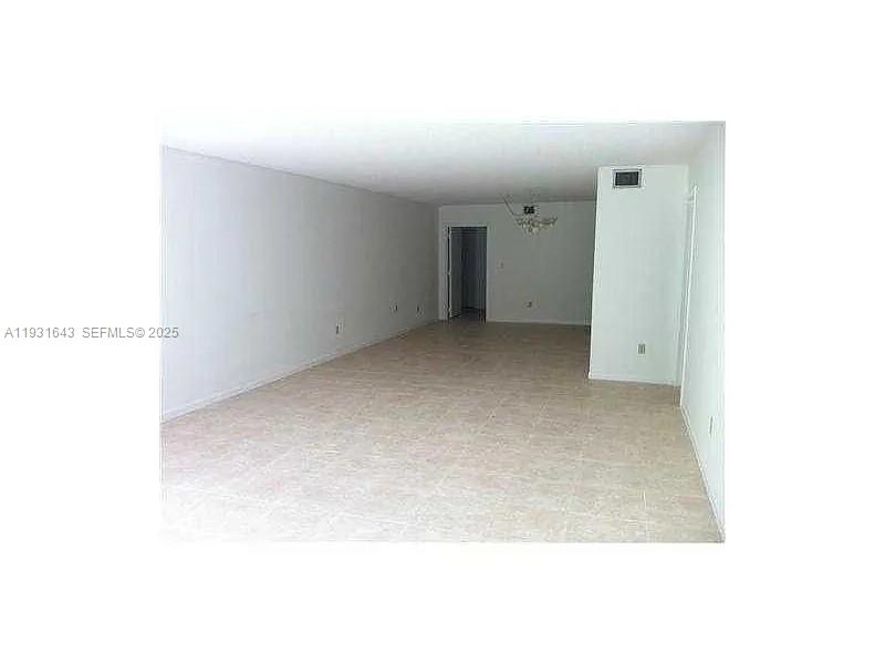 20860 San Simeon Way, Unit 3026 Miami, FL 33179 - Photo 11 of 17 a view of an empty room