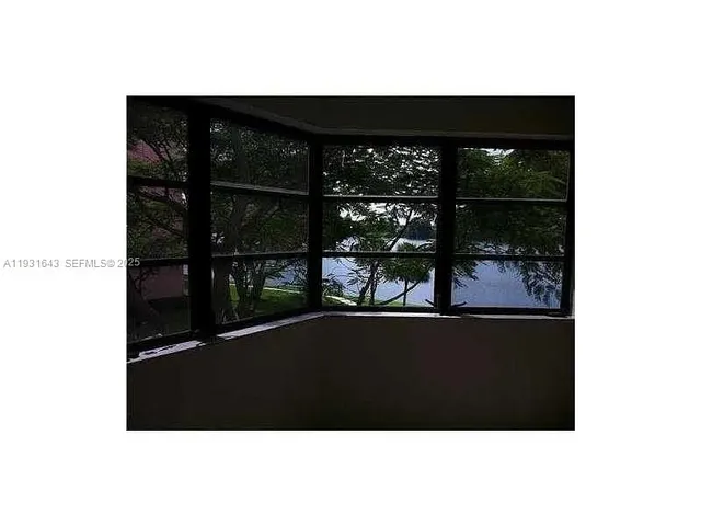 a living room with a black and white wall