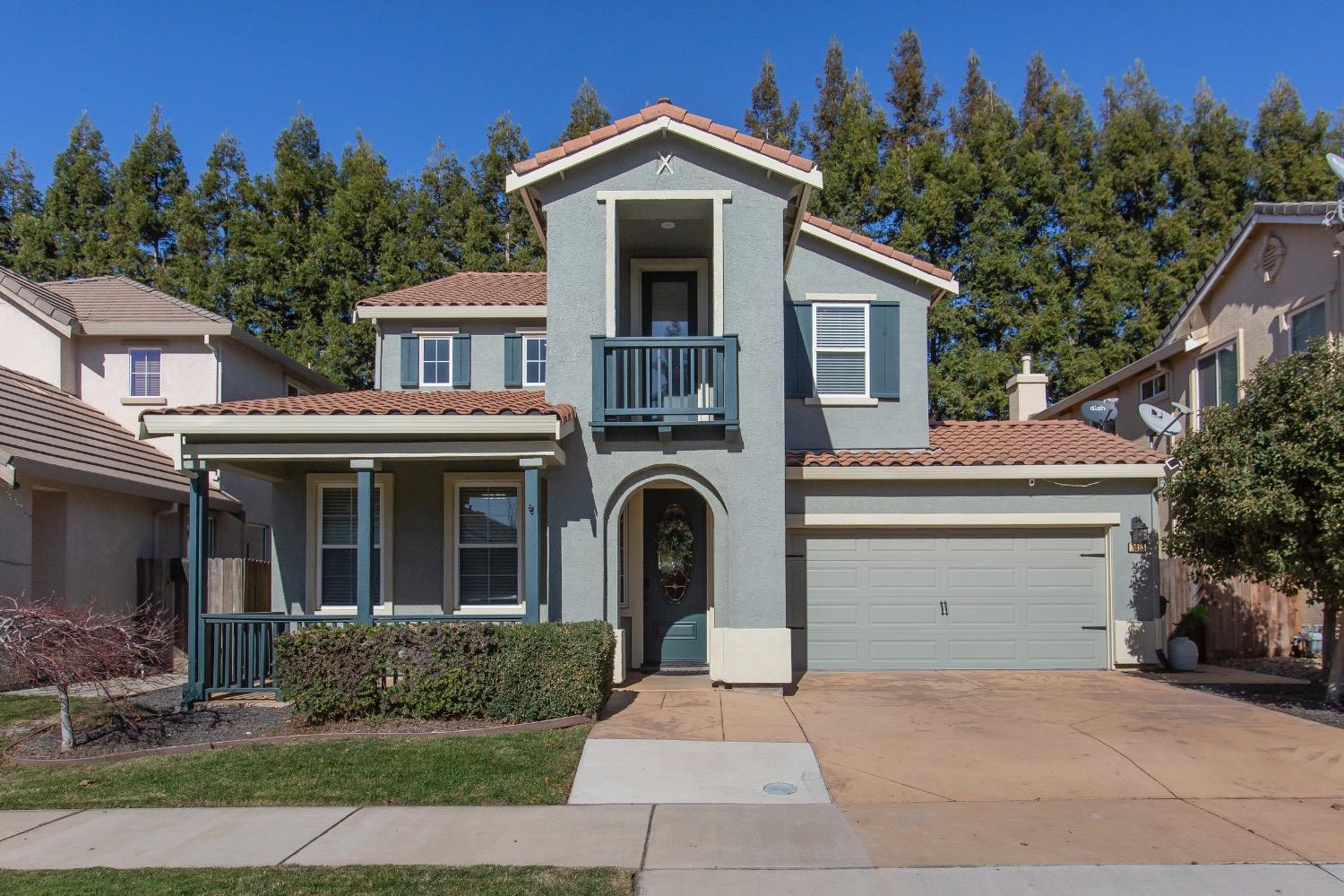 a front view of a house with yard