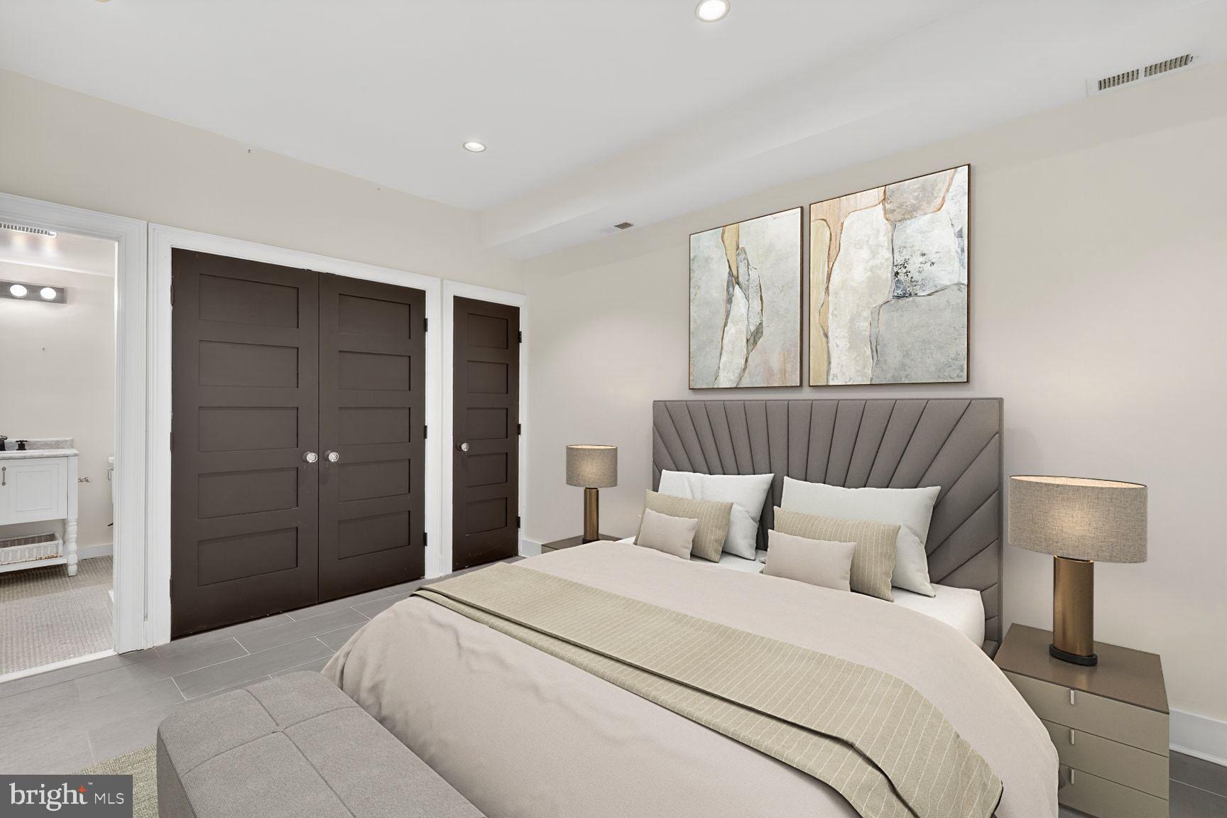 3019 Dent Place Northwest Washington, DC 20007 - Photo 12 of 17 a bedroom with a bed and a lamp