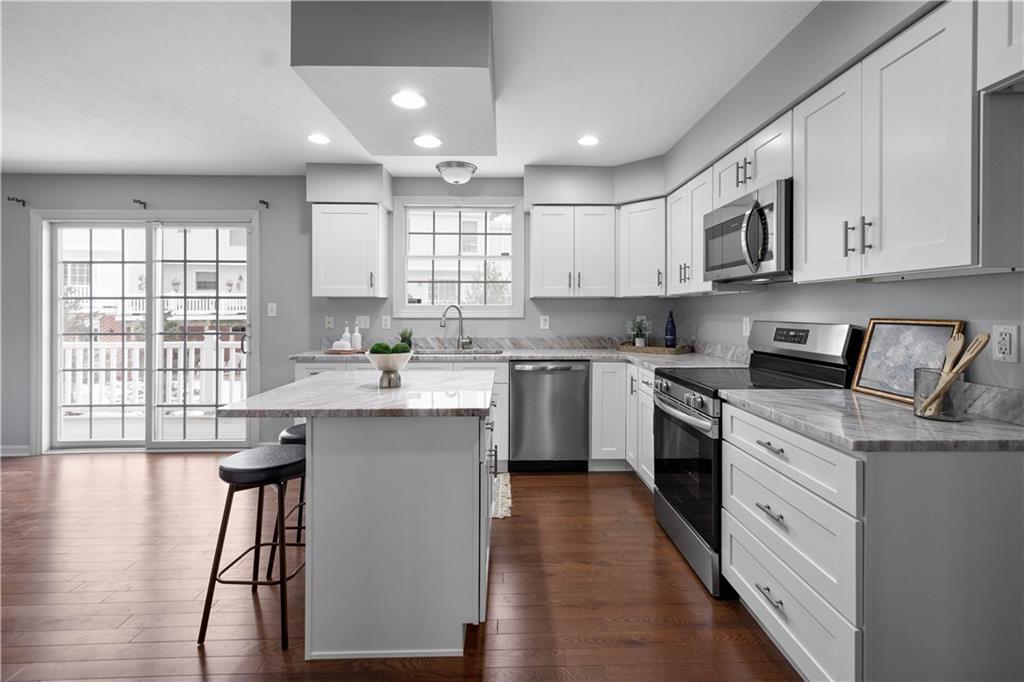 271 Overlook Court Coraopolis, PA 15108 - Photo 15 of 46 a kitchen with a sink white cabinets and white appliances