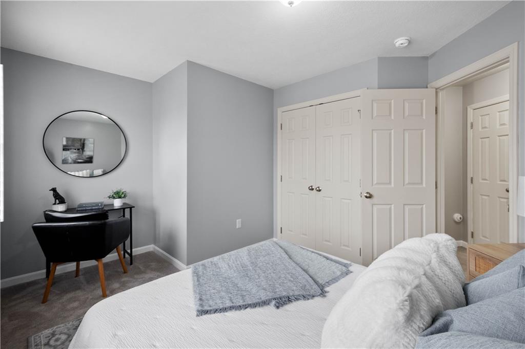 271 Overlook Court Coraopolis, PA 15108 - Photo 29 of 46 a bedroom with a bed and a chandelier