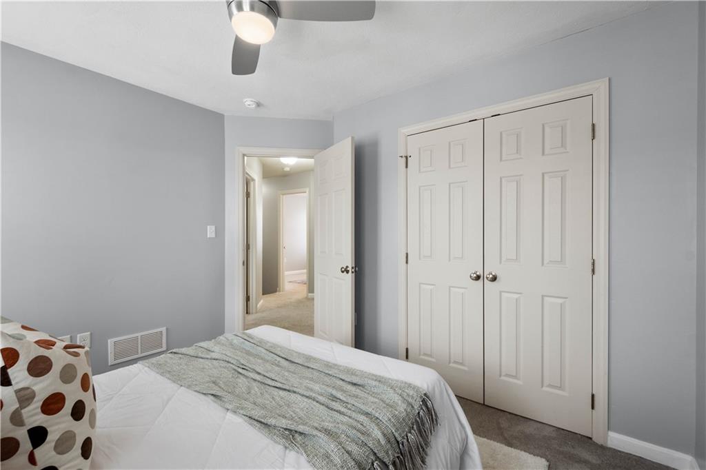 271 Overlook Court Coraopolis, PA 15108 - Photo 31 of 46 a bedroom with a bed and a chandelier