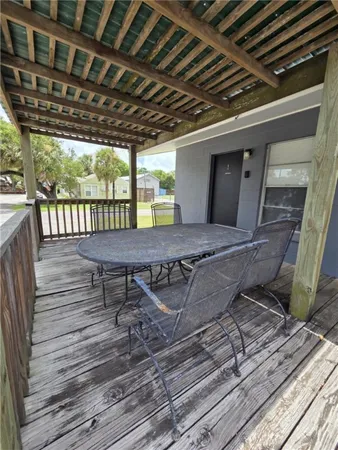 a view of a chairs and table in the patio