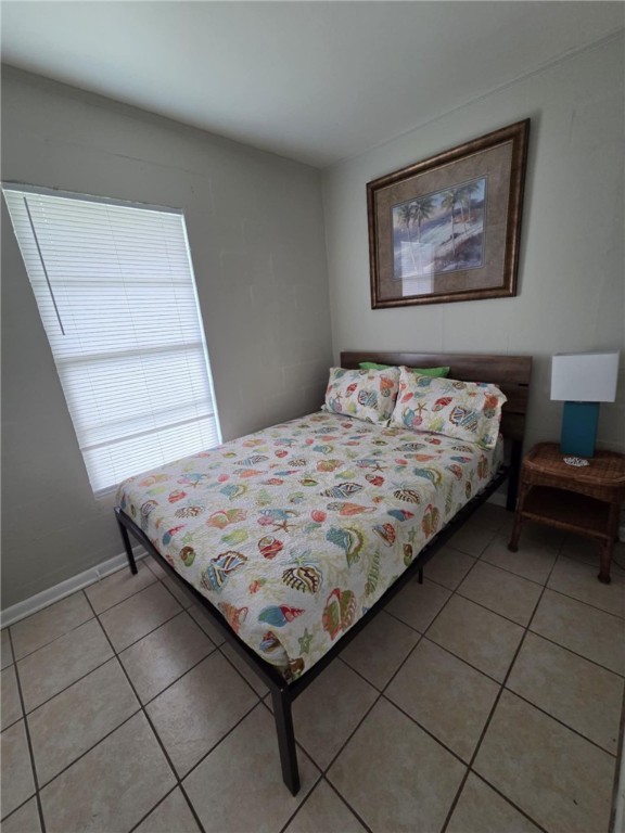 302 Broadway Street Fulton, TX 78382 - Photo 17 of 38 a bed sitting in a bedroom next to a window