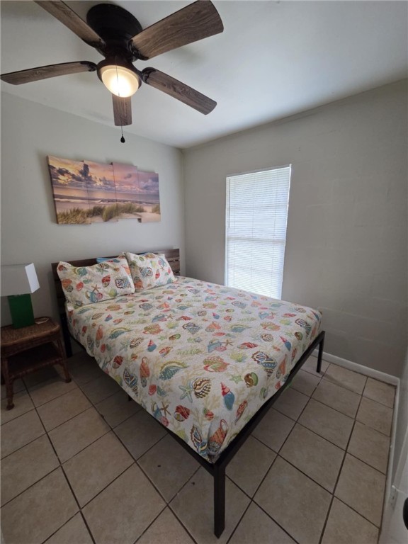 302 Broadway Street Fulton, TX 78382 - Photo 18 of 38 a bedroom with a bed and a lamp on the dresser