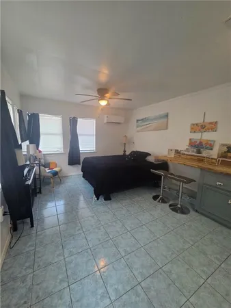 a living room with furniture a flat screen tv and dresser