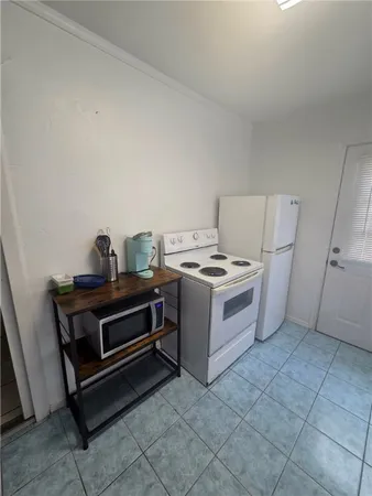 a utility room with washer and dryer
