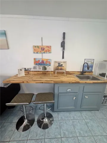 a living room with a couch and potted plant