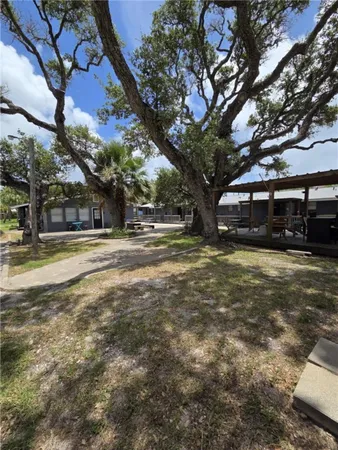 a house view with swimming pool