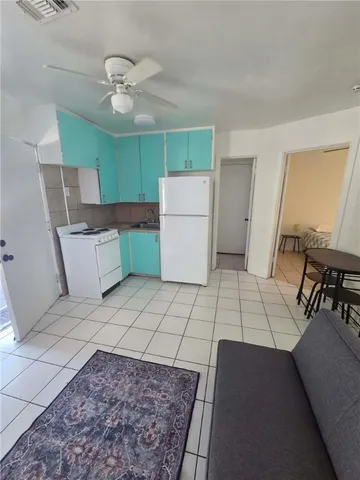 a bedroom with furniture and a chair