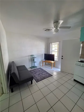 a bathroom with a toilet a sink and shower