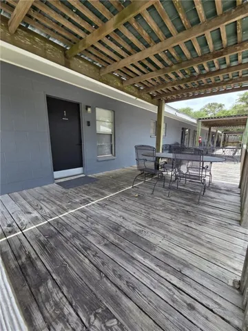 a patio with table and chairs