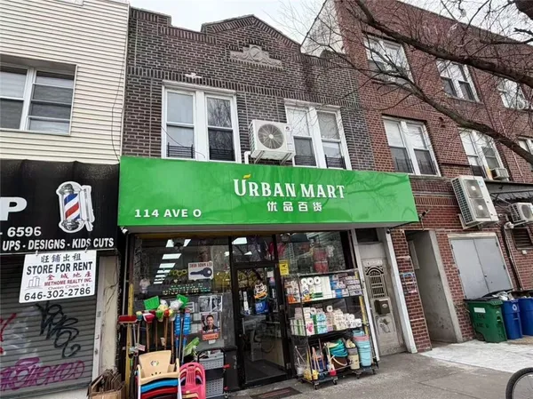 a front view of building with retail shops