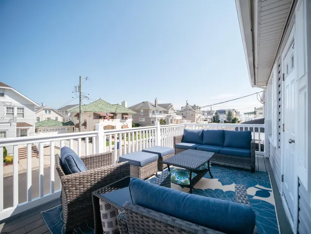 a balcony with furniture and city view