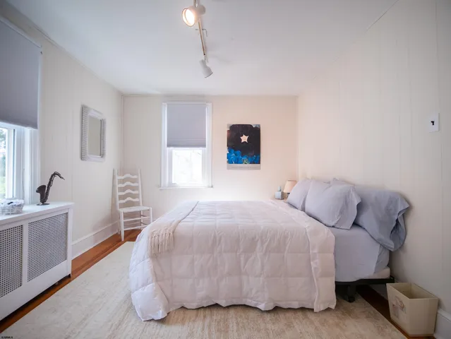 a bedroom with a bed and a table