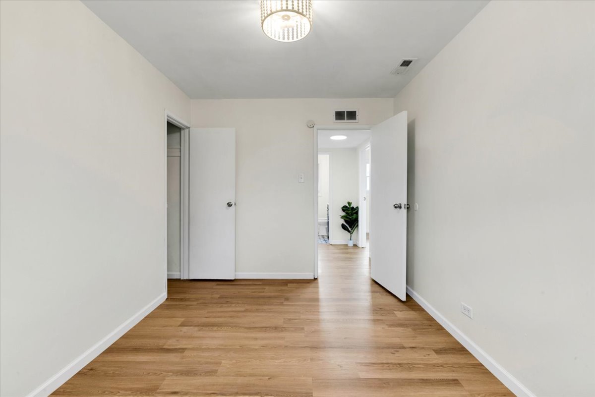 192 Monee Road Park Forest, IL 60466 - Photo 17 of 25 a view of an empty room with wooden floor