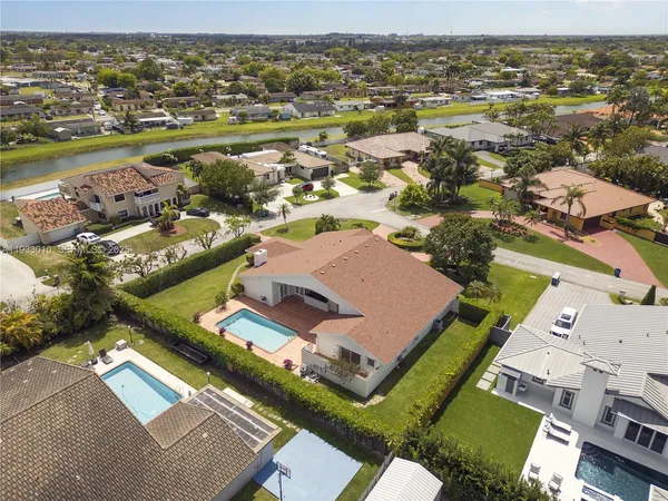 an aerial view of residential houses with outdoor space