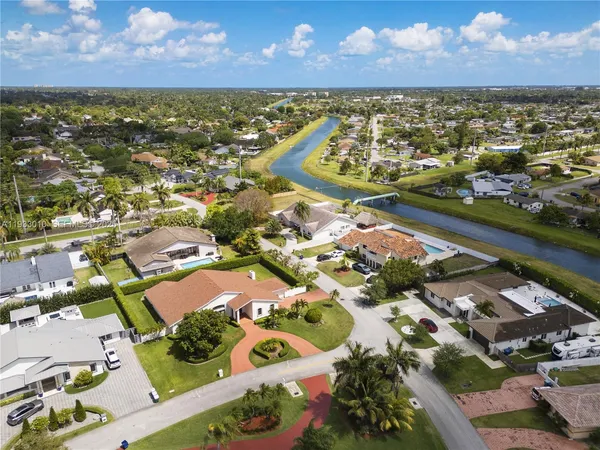 an aerial view of a house with outdoor space