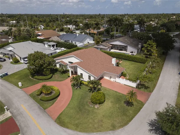 an aerial view of residential houses with outdoor space