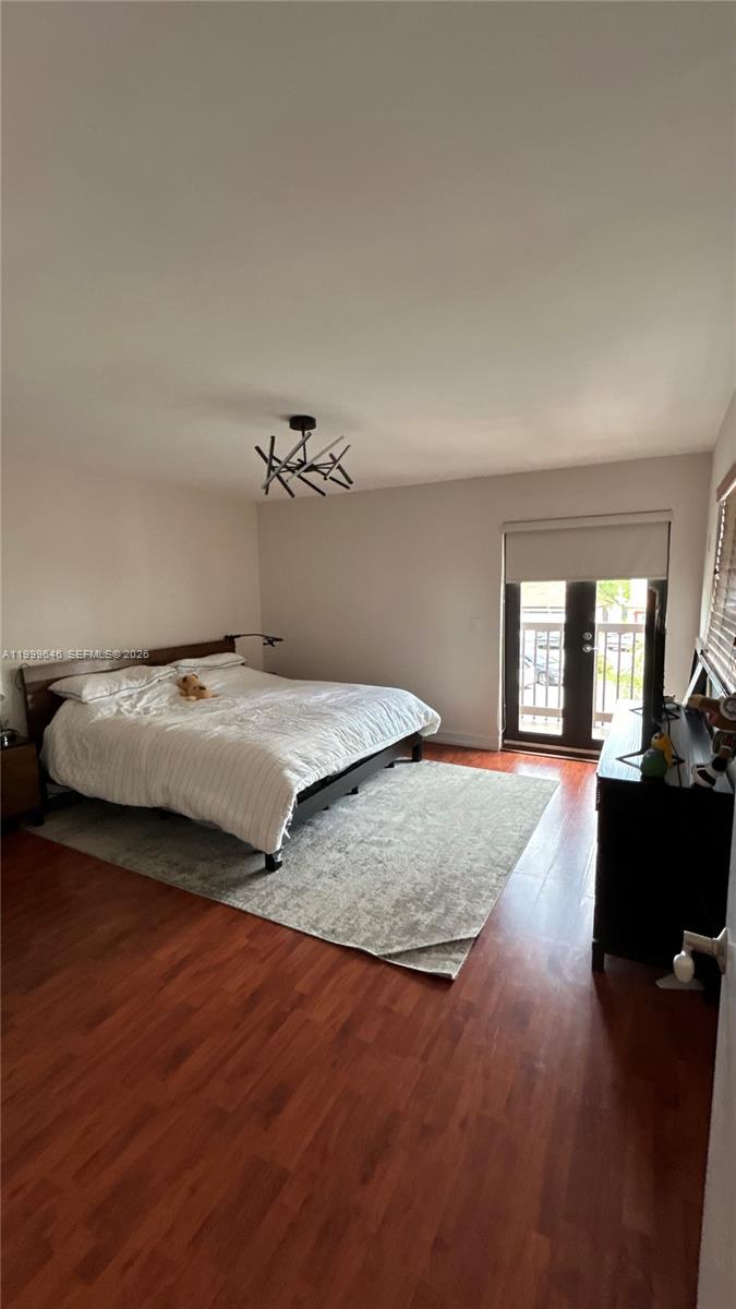 13267 Southwest 9th Lane Miami, FL 33184 - Photo 23 of 53 a bedroom with a bed and window