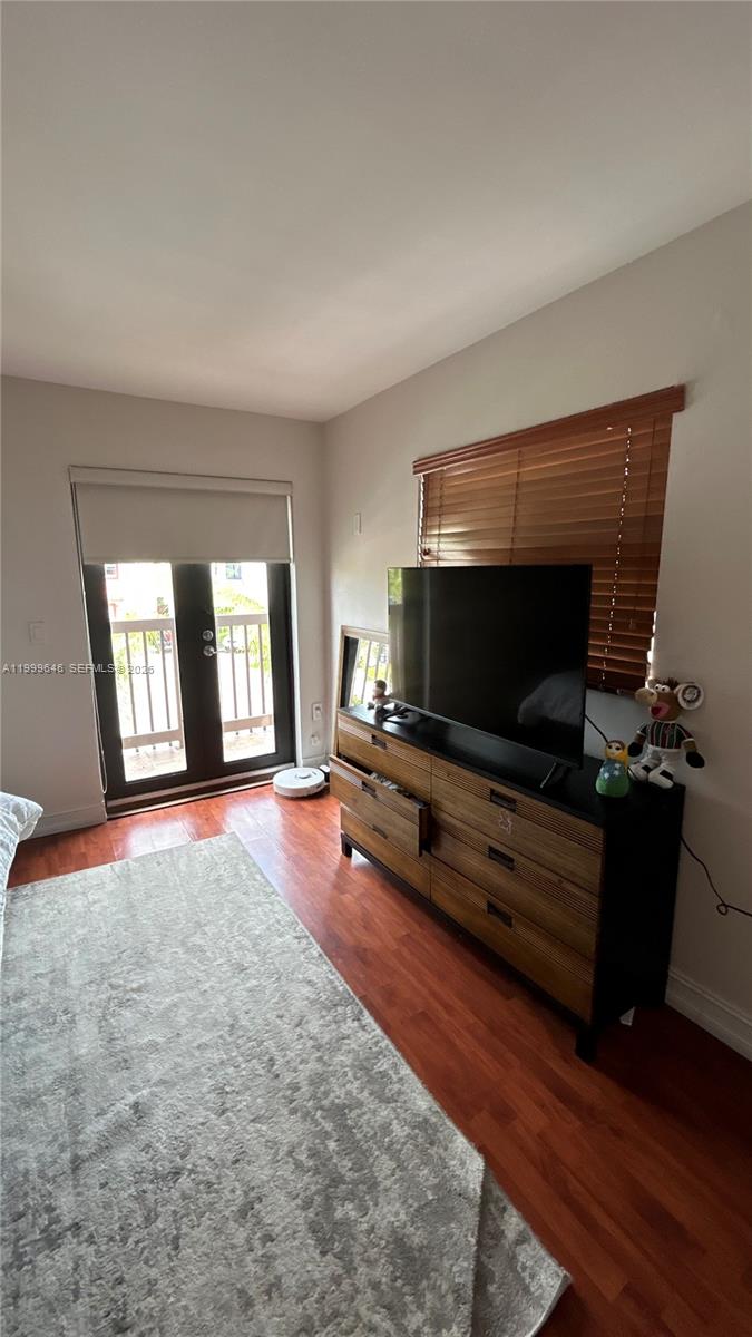 13267 Southwest 9th Lane Miami, FL 33184 - Photo 24 of 53 a living room with furniture and a flat screen tv